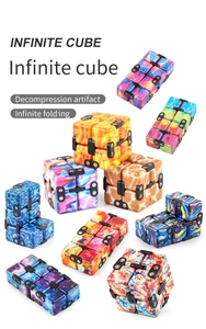 Detailed view of Infinite Cube designs including galaxy and flame patterns for stress relief