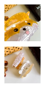 Detail view of Shiba Inu acetate hair claws showing cat-shaped textures and metal clips