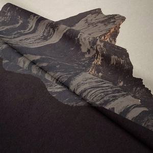 Close-up of bohemian mountain tapestry fabric with soft velvet texture and draped folds