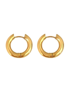 Detailed view of thick gold hoop earrings with polished finish and hinged closure