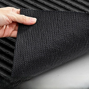Detailed view of the durable rubber backing with anti-slip round stud texture