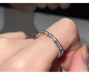 Detailed view of S925 silver ring featuring rainbow gradient pavé-set cubic zirconia