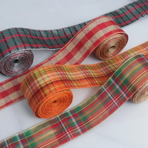 Detail of plaid ribbons with metallic wired edges for Christmas bows and party decor