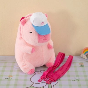 Pink Capybara plush backpack with cute blue cap and adjustable shoulder straps details