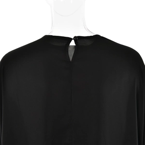 Detail of round neckline with teardrop cutout and single button closure on black satin dress