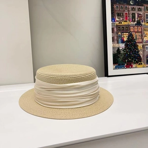 Elegant beige straw flat top hat with creamy silk ribbon for summer sun protection
