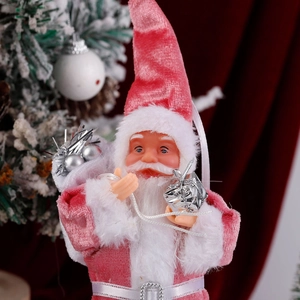 Close-up of a plush pink velvet Santa Claus figurine hanging ornament for Christmas decor
