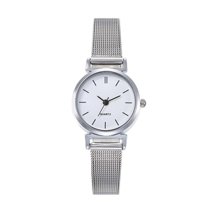Detail of silver mesh band and white minimalist dial of women's quartz watch