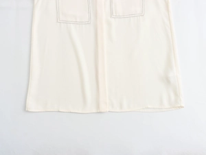 Close-up of hemline and pocket stitching on white crepe chiffon casual shirt for women