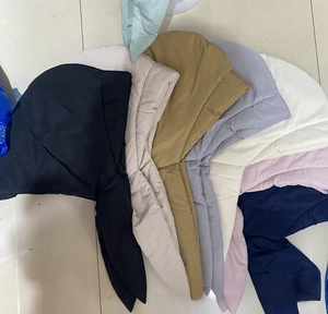 Multiple colors of windproof down hoods showing waterproof fabric and thick quilted texture