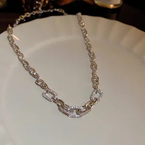 Silver-tone thick chain necklace with three sparkling rhinestone rectangular links