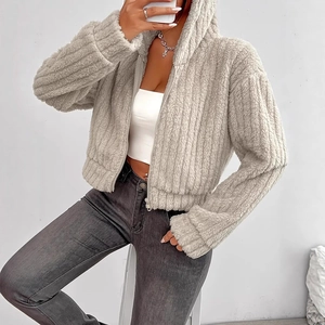 Detail of light beige plush zip-up hoodie featuring distinctive vertical striped texture