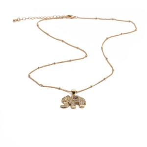 Close-up of gold elephant pendant with micro-pave zircons and multi-colored gemstones