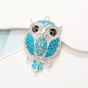 Sparkling diamond-encrusted owl pendant in sky blue and silver for DIY jewelry crafts