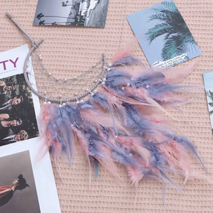 Bohemian moon dreamcatcher with grey weaving, white pearls and pink blue feathers
