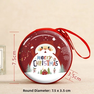 Detail showing a 7.5cm round tinplate Christmas coin purse with Santa Claus pattern