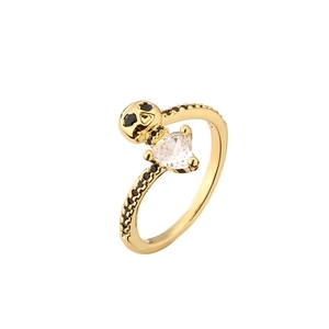 Gothic gold skull ring featuring a heart-shaped gemstone and black micro-pavé crystals