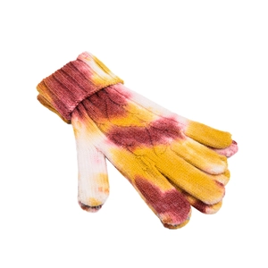 Detail view of tie-dye winter knit gloves with warm ribbed cuffs and touch screen fingertips