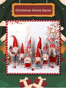 Detail of Nordic Christmas gnomes with reindeer hats standing by a festive fireplace
