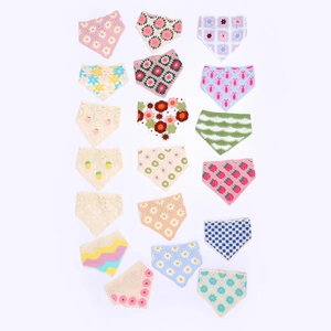 Flat lay of diverse handmade crochet bandana headbands with floral and strawberry patterns