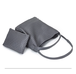 Grey hand-woven PU leather tote bag with matching inner pouch detail and texture
