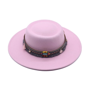 Pink wide brim boho hat detail with colorful beads, turquoise stones and tassels