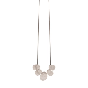 Minimalist long sweater necklace with irregular oval matte silver pebble pendants on a cord