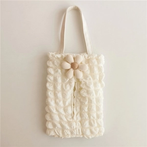 Detail of cream bubble pleated tissue hanging bag with 3D floral accent for car seats