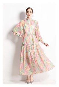 Detail of retro floral print dress showing stand collar and colorful patchwork pattern