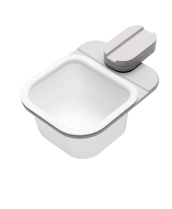 Close-up of white plastic rotating desktop bin with grey clamp for kitchen storage