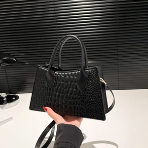 Black crocodile embossed tote bag with top handles and detachable shoulder strap for women