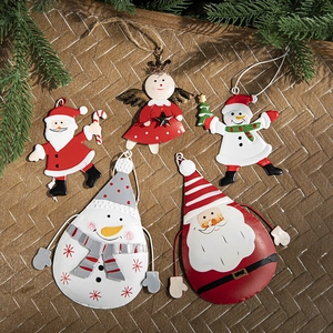 Set of five painted metal Christmas ornaments featuring Santa, Snowman and Angel on pine