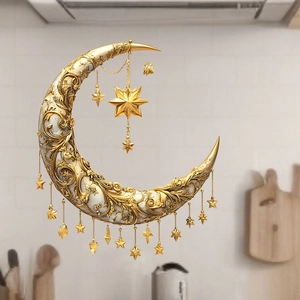 Golden crescent moon and stars wall hanging with embossed patterns for home decor