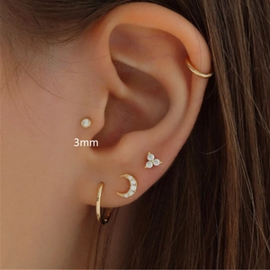 Close-up of S925 silver gold studs featuring a 3mm diamond, moon, and triangle shapes
