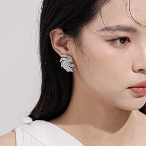 Silver twisted spiral stud earrings for women with a modern geometric textured design