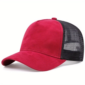 Close-up of red suede fabric and black breathable mesh on a classic trucker hat