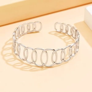 Bracciale rigido aperto in acciaio inossidabile argento con intagli geometrici ovali