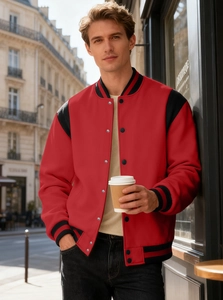 Outdoor street photo of a men's red and black varsity jacket with silver metal buttons