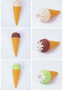 Detailed view of artificial ice cream cones in vanilla chocolate and mint flavors