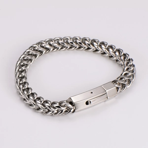 Close-up of a silver polished 8mm stainless steel Cuban link bracelet with a secure box clasp