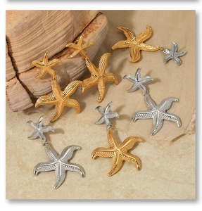 Detail of vintage starfish earrings showing textured metal finish in gold and silver colors