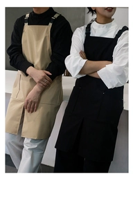 Front view of khaki and black waterproof cotton canvas aprons with adjustable straps