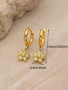 Detailed view of gold flower hoop earrings with yellow crystal and size annotations