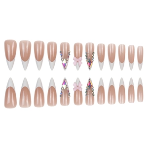 Long stiletto French press-on nails with white tips, 3D pink bows, and crystal rhinestones