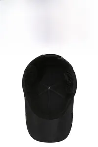 Detail view of winter baseball cap showing thick quilted lining and foldable ear flaps
