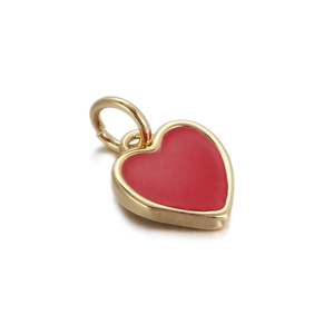 Close-up of heart-shaped 18K gold plated pendant with red enamel inlay and golden border
