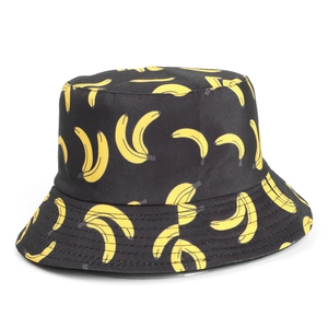Detailed top view of black cotton bucket hat with vibrant yellow banana print pattern