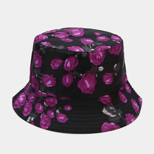 Detailed view of purple rose floral print on black cotton bucket hat with stitching