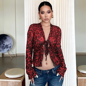 Close-up of red leopard print sheer mesh cardigan with front tie detail and long sleeves