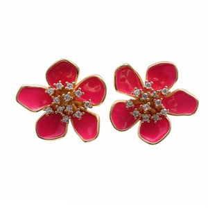 Detailed shot of flower earrings with magenta enamel petals and sparkling rhinestones